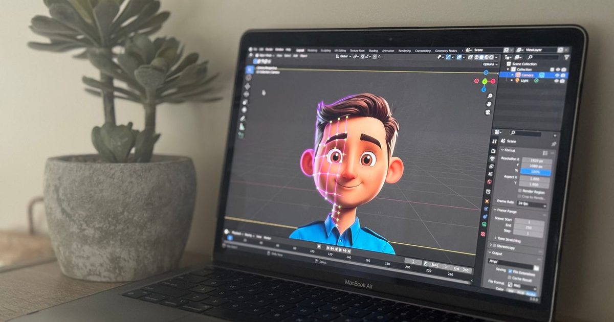 A laptop showing 3D animation software on a creative desk