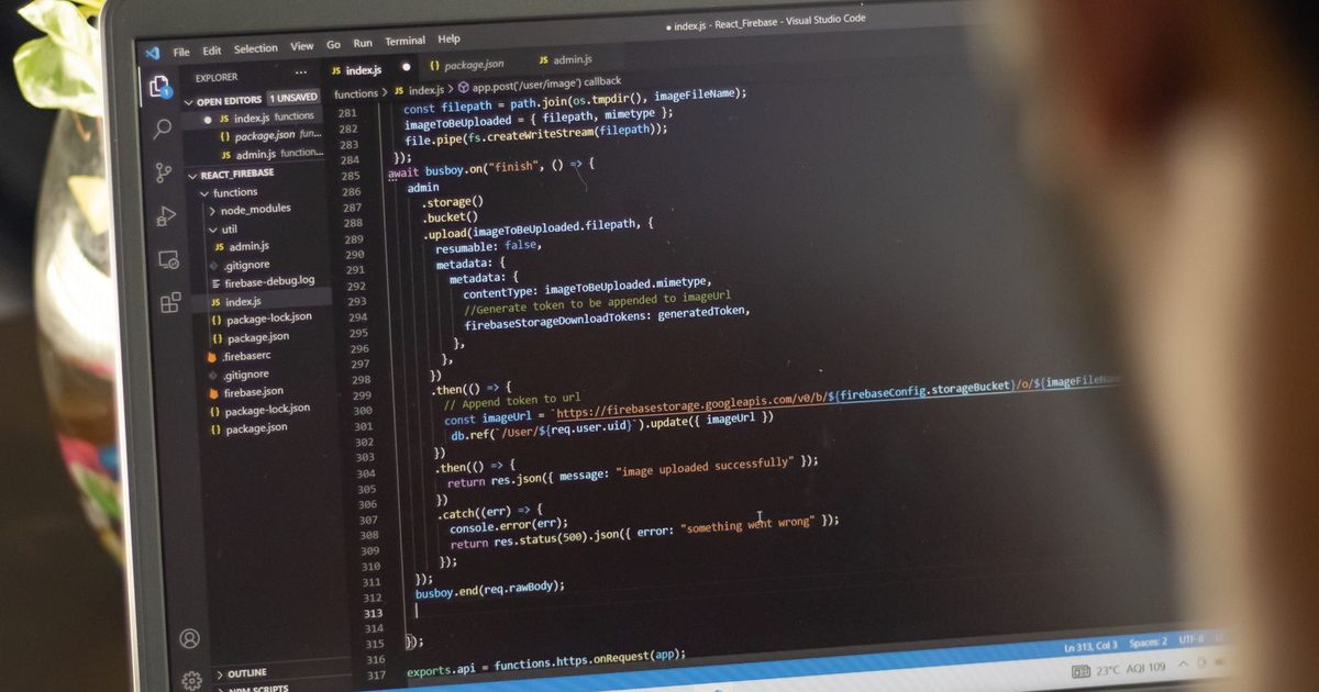 A solo developer coding on a laptop in a quiet workspace
