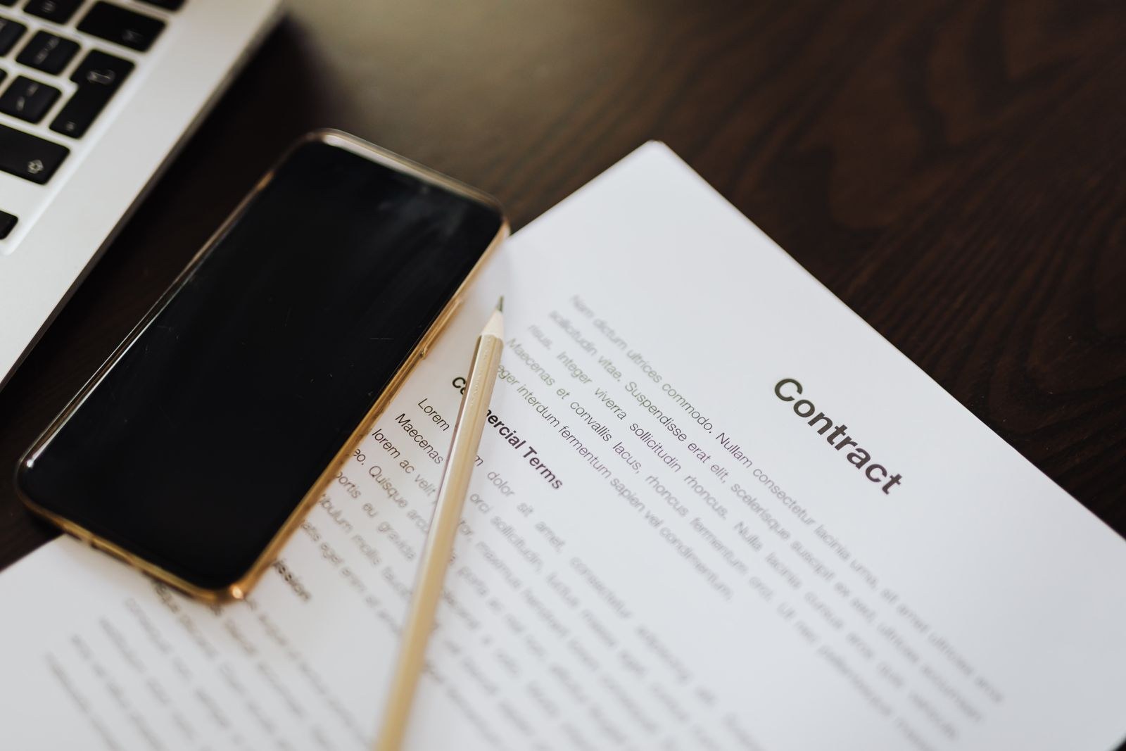 A document and a smartphone side by side on a desk